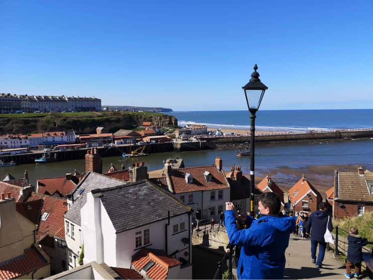 Whitby and it's pier, taken from midway up the famous 199 steps to the Whitby abbey.
