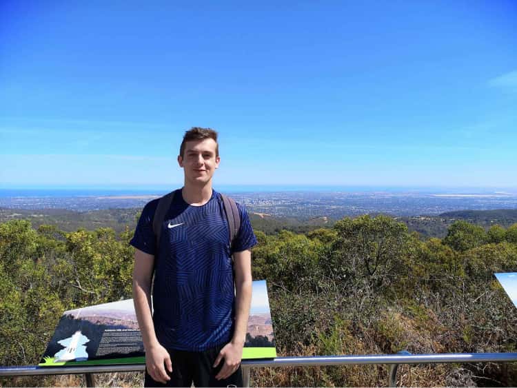 Myself stood on top of the tallest hill in Adelaide, with a view of grasslands and Adelaids's central business district far in the background.