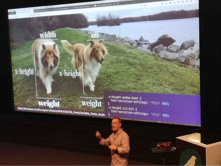 Typography expert Jason Pamental presenting a slide where he is relating typography properties to the physical features of his two dogs.